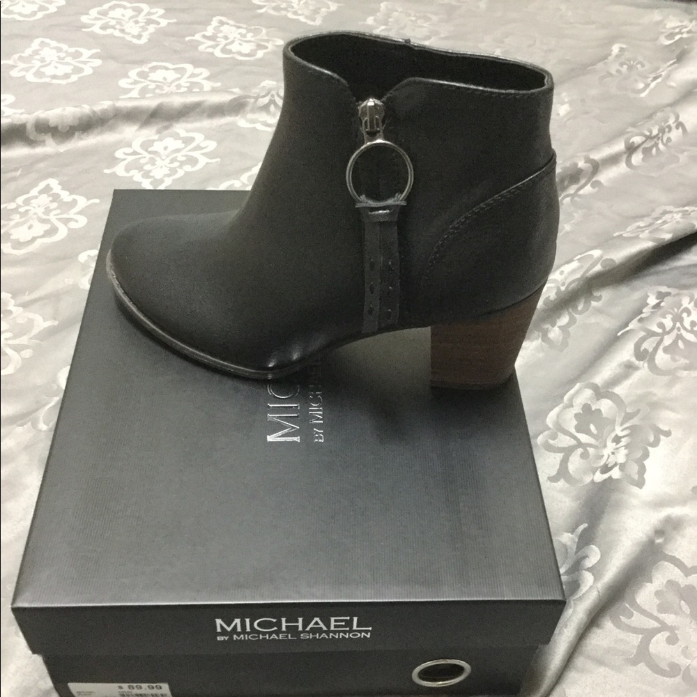 Black booties. Faux leather.